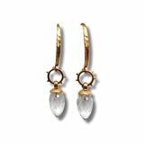 Gold earrings with rock crystals on a white background