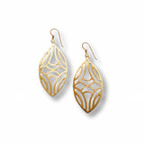 Gold plate earrings with intricate designs on a white background