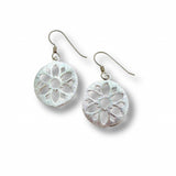Pair of silver floral earrings on a white background