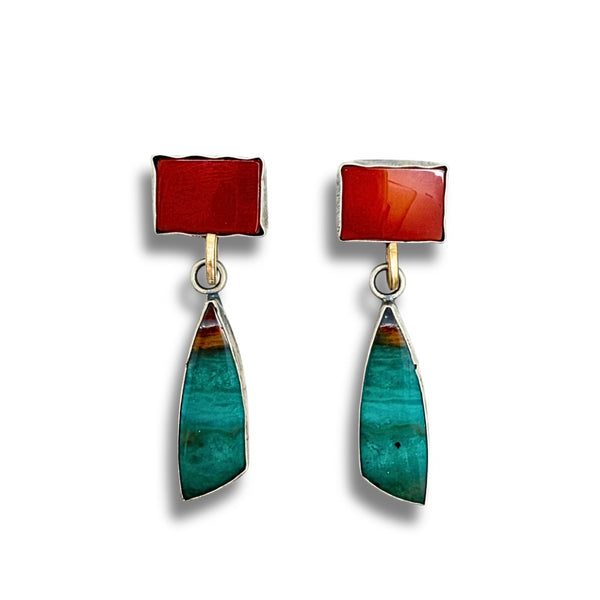A pair of handmade dangle earrings featuring a rectangular red carnelian top section and a teardrop-shaped green and blue marbled drop section, set in silver with gold-tone connectors, shown on a white background.